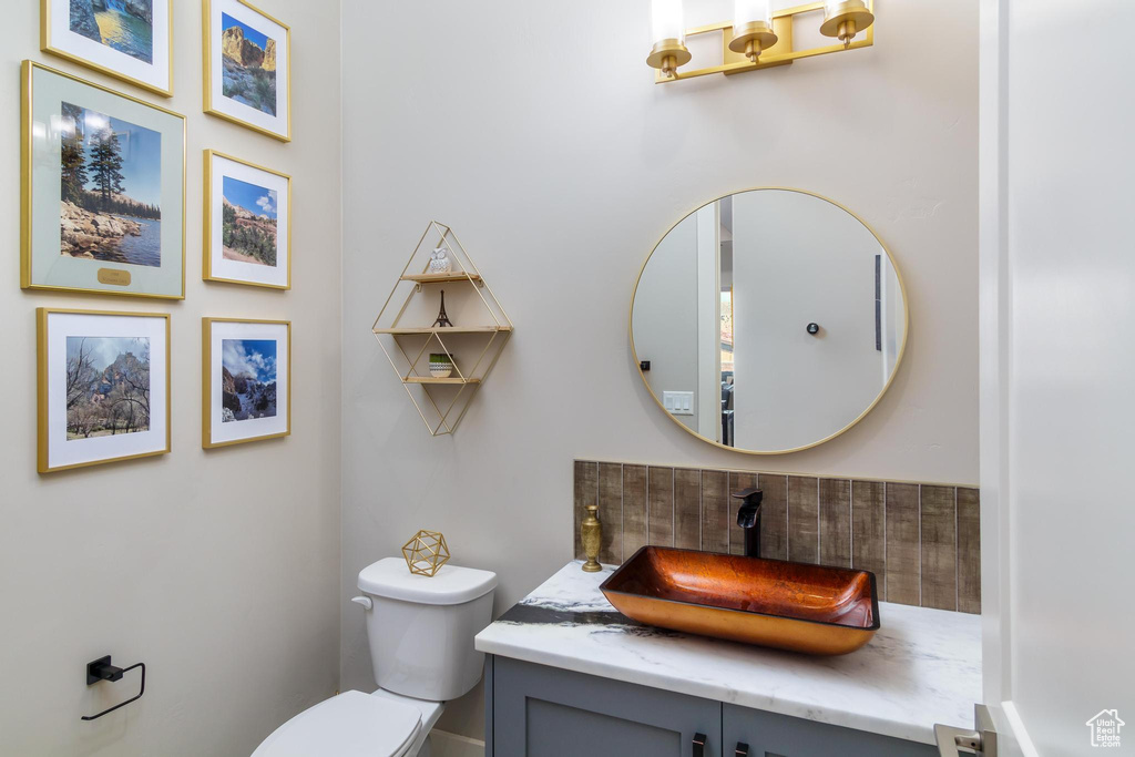 Bathroom featuring vanity and toilet