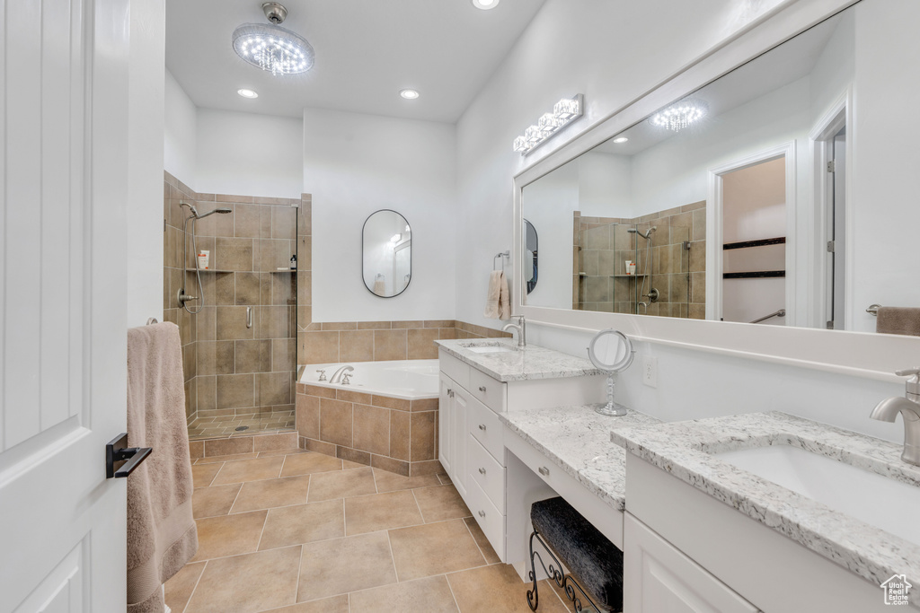 Bathroom with vanity, plus walk in shower, and tile patterned floors