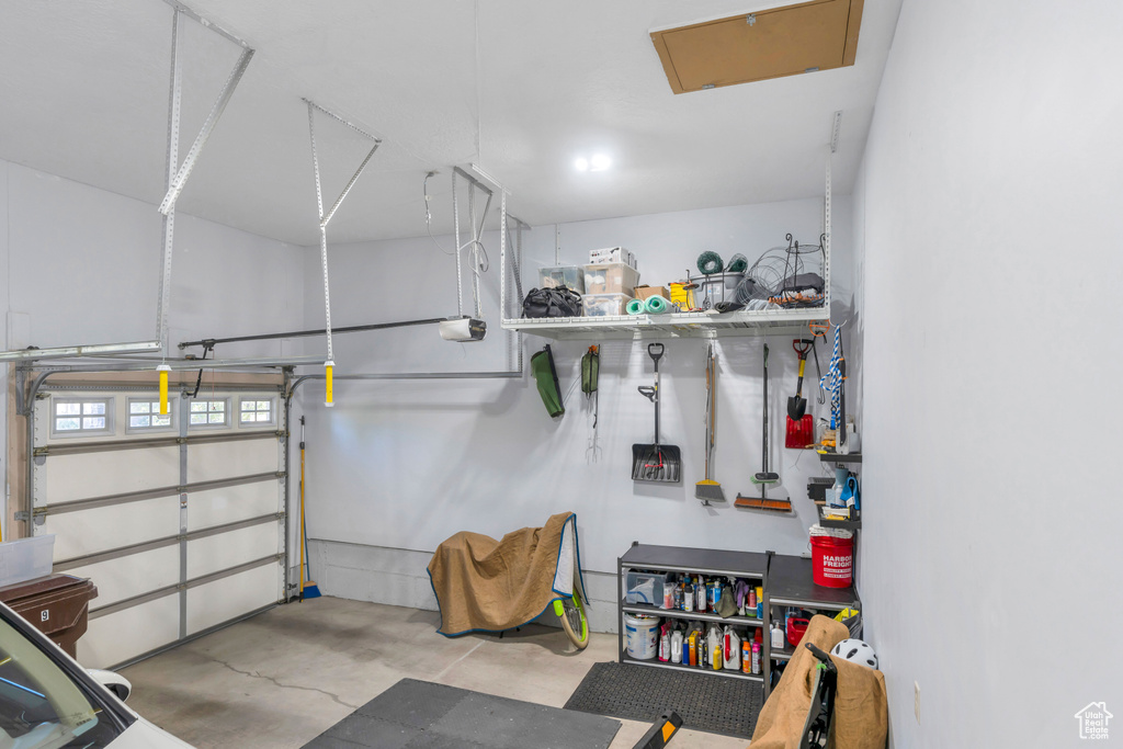 Garage featuring a garage door opener