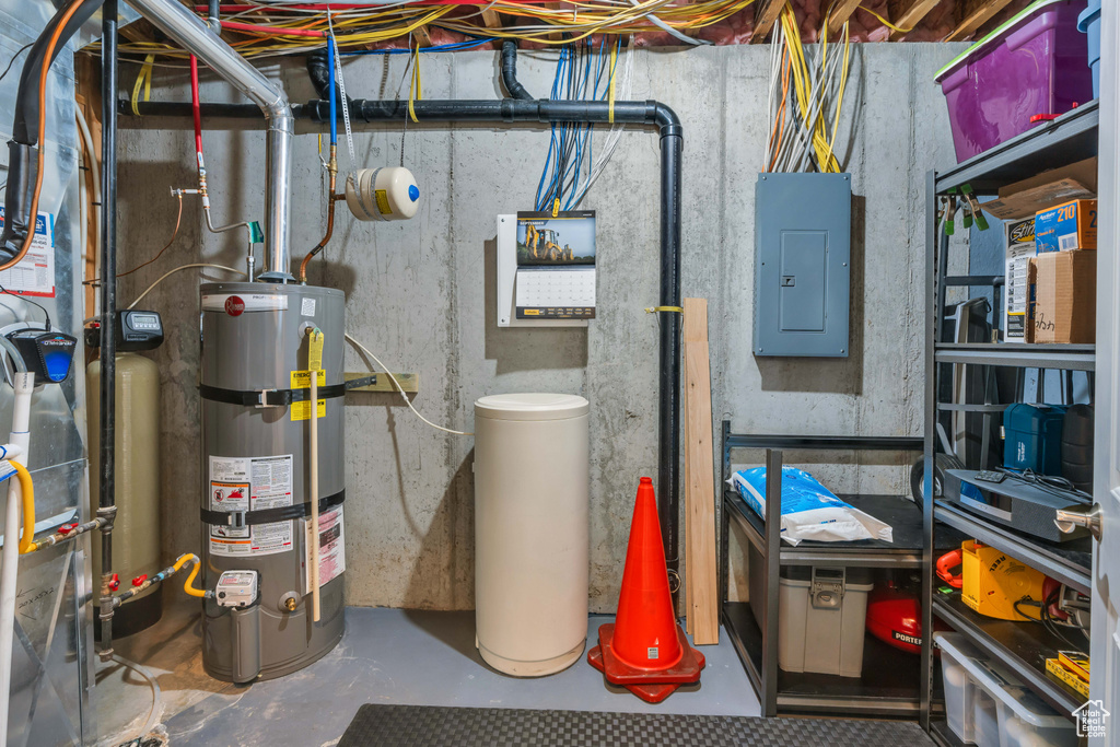 Utility room with electric panel and secured water heater