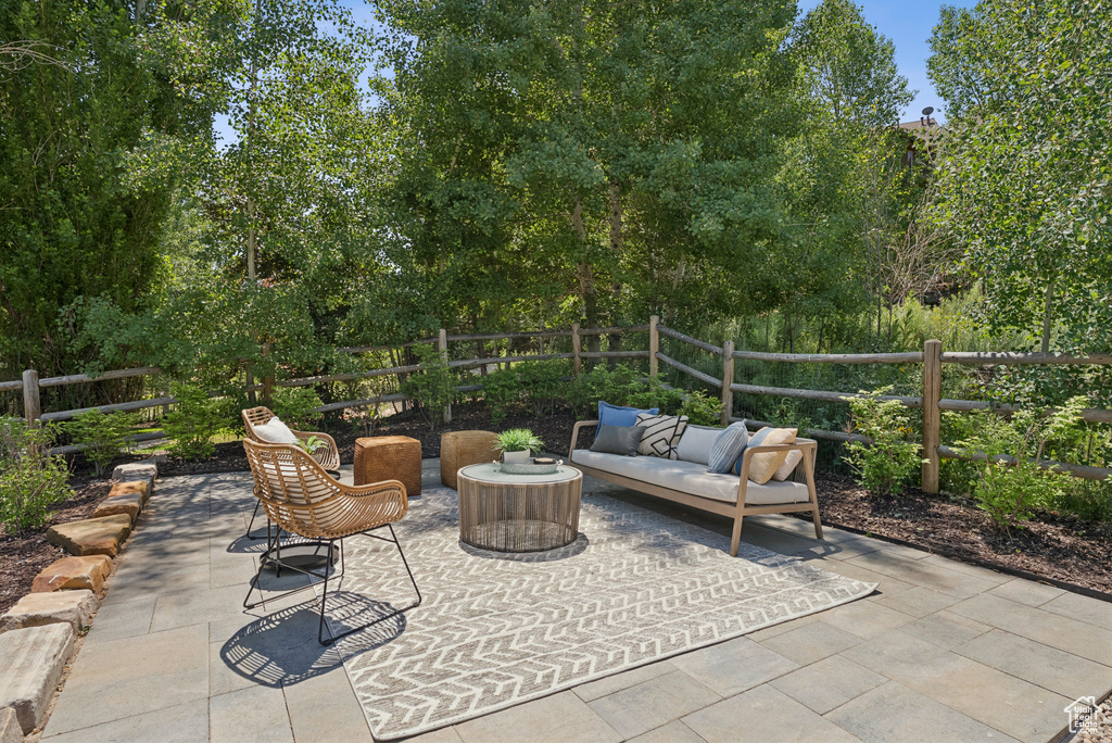 Fenced backyard with a patio and an outdoor hangout area