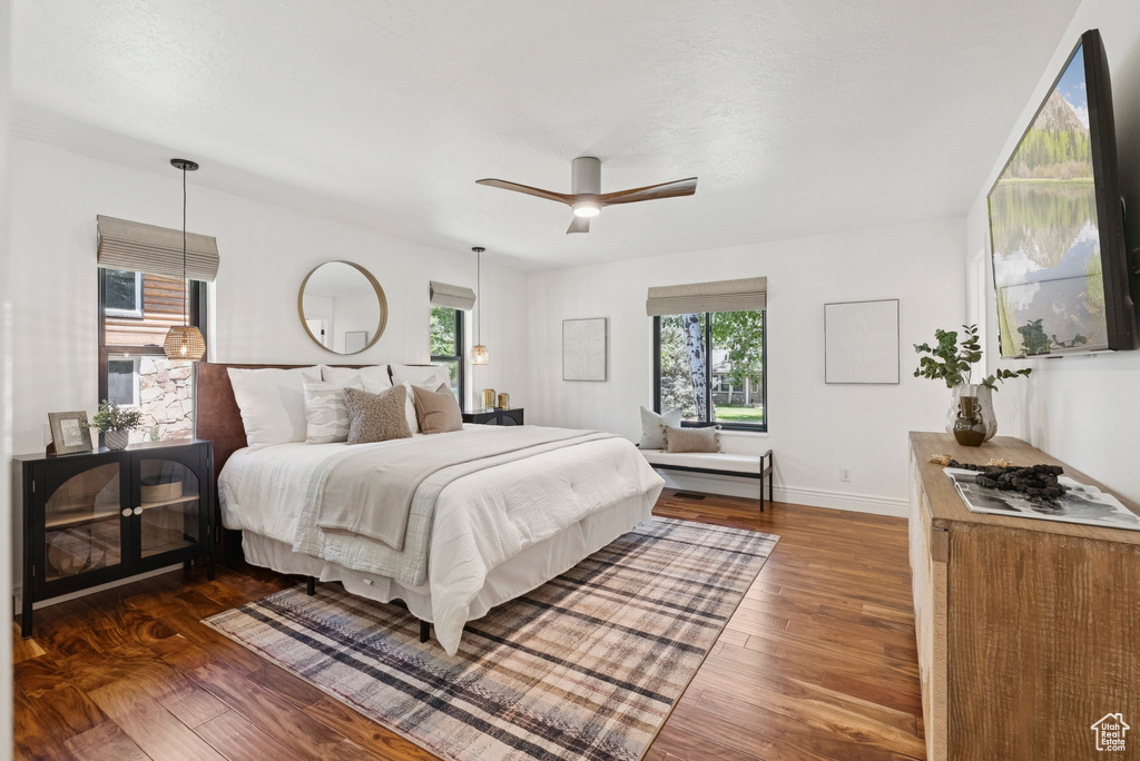 Bedroom with wood finished floors and ceiling fan