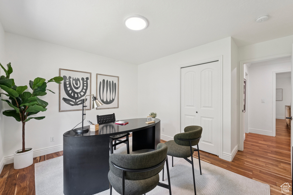 Home office with wood finished floors