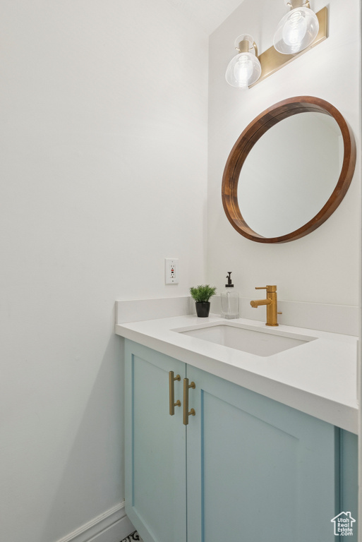 Bathroom with vanity and baseboards