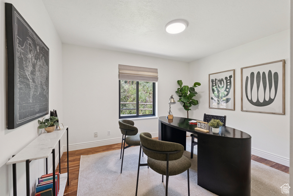 Office featuring wood finished floors and baseboards