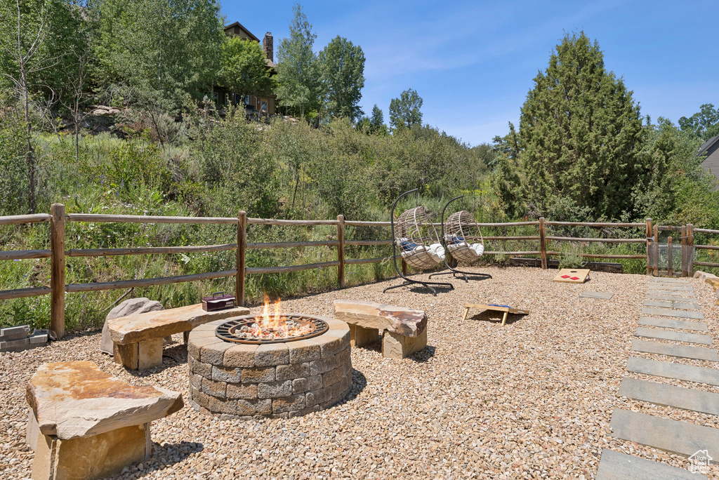 View of patio / terrace with an outdoor fire pit