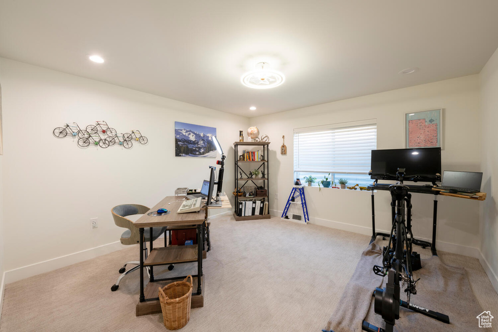 Home office with light carpet