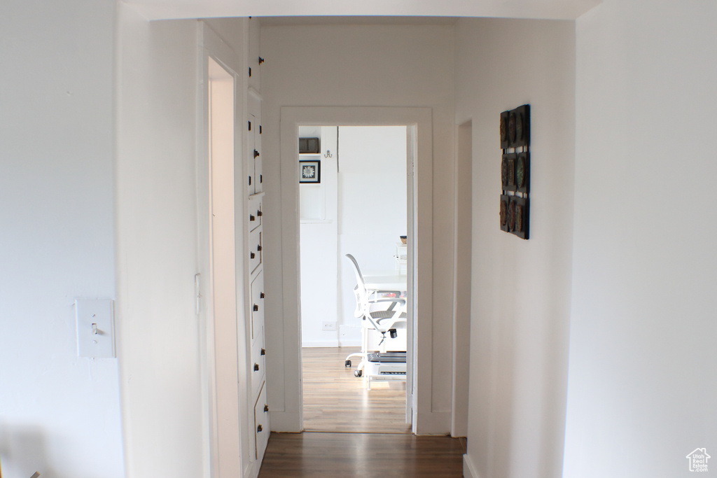 Corridor with dark wood-type flooring