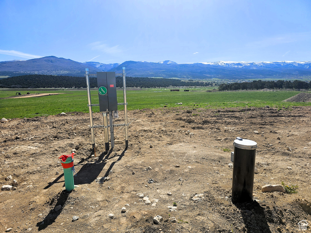 View of mountain background featuring rural landscape