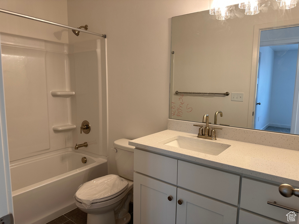 Full bathroom with shower / bathtub combination, tile patterned floors, vanity, and toilet