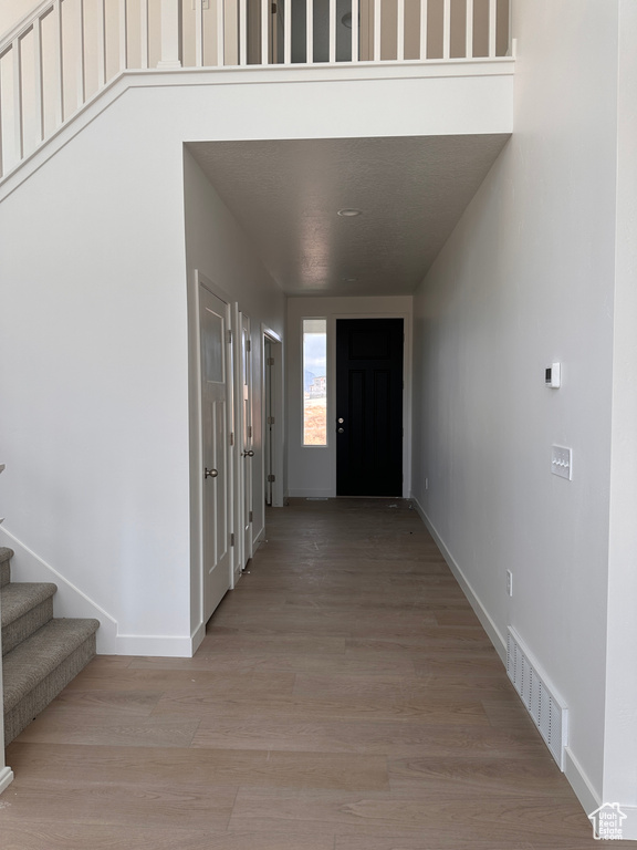 Hallway featuring light hardwood / wood-style flooring