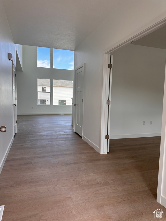 Hallway featuring wood-type flooring