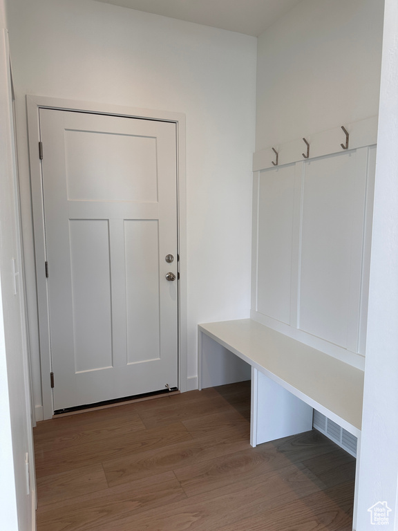 Mudroom with light hardwood / wood-style flooring