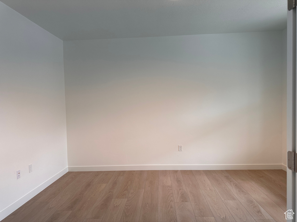 Empty room featuring light hardwood / wood-style flooring