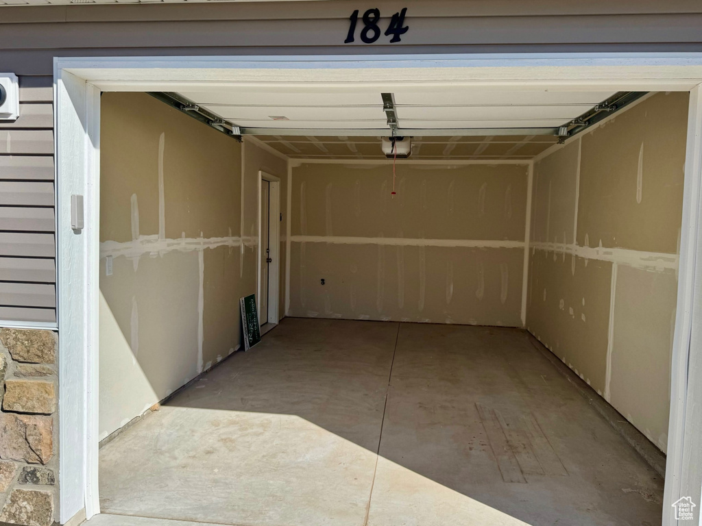 Garage featuring a garage door opener