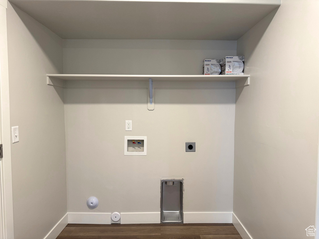 Laundry room with washer hookup, gas dryer hookup, dark hardwood / wood-style floors, and electric dryer hookup