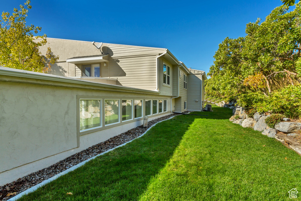 View of yard with central AC