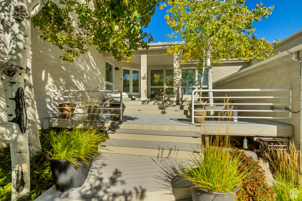 Property entrance with a wooden deck