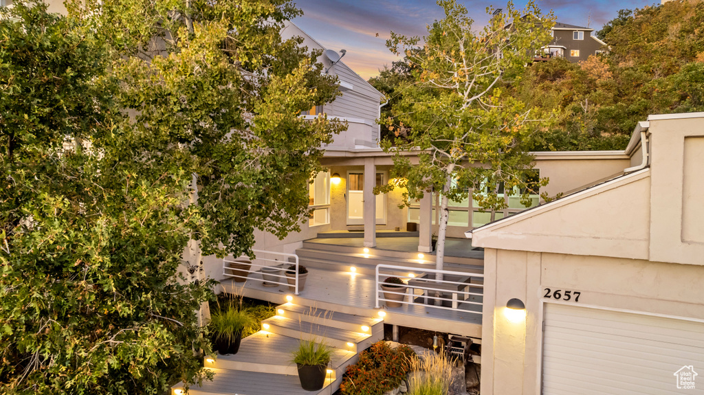 View of front of property featuring a wooden deck