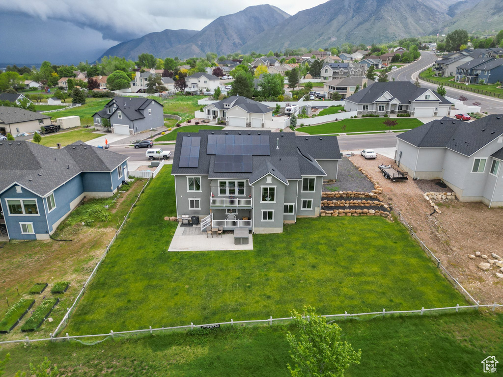 Aerial perspective of suburban area with a mountain backdrop