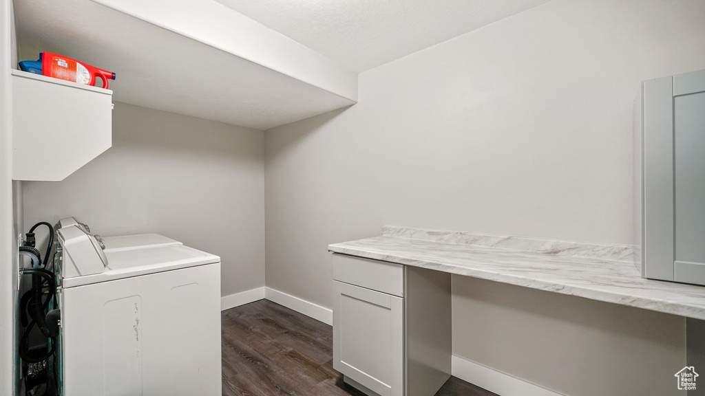 Washroom with separate washer and dryer, dark wood-style flooring, baseboards, and an office area