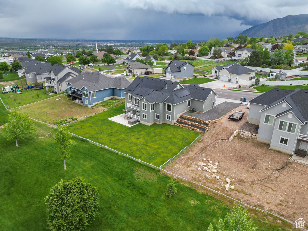 Aerial perspective of suburban area with a mountain backdrop