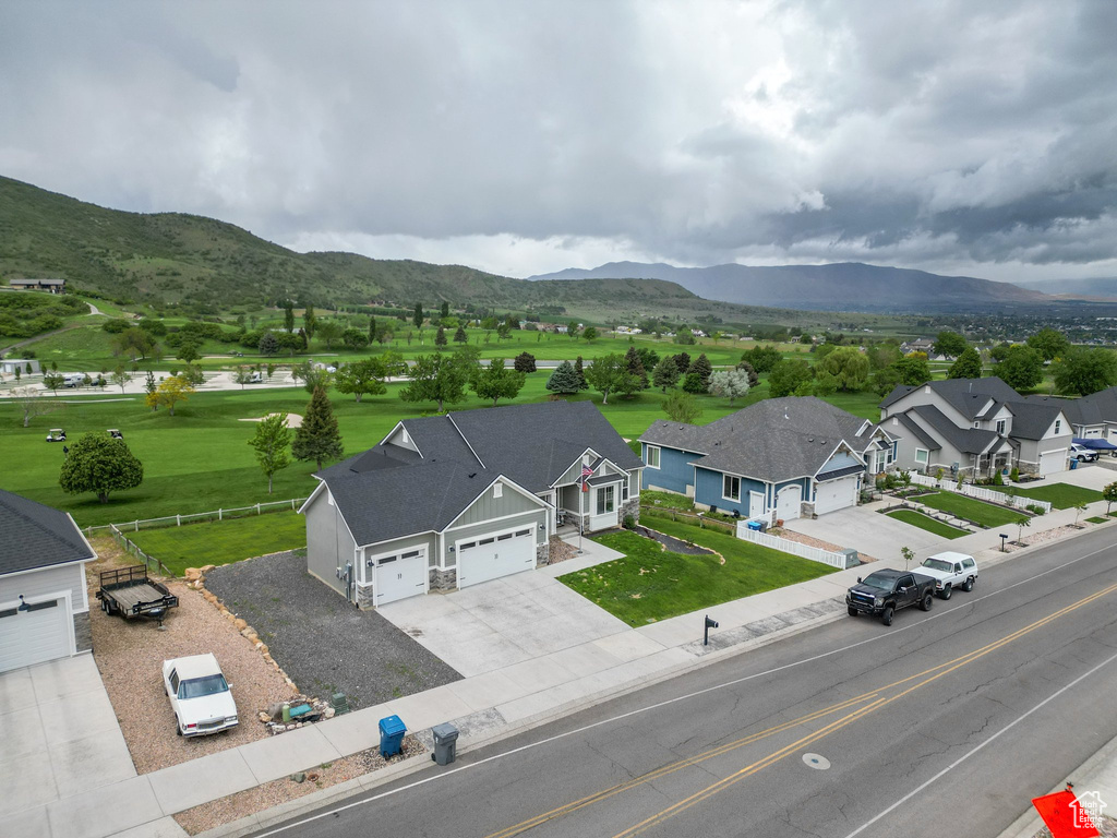 Aerial view of residential area featuring a mountainous background
