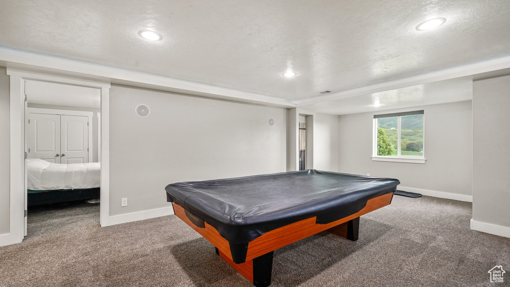Recreation room featuring baseboards, carpet, recessed lighting, pool table, and a textured ceiling