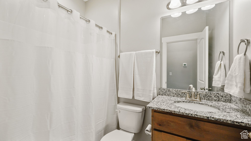 Bathroom featuring toilet and vanity