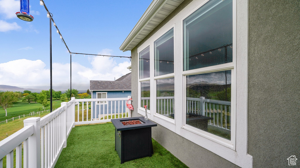 Balcony featuring an outdoor fire pit