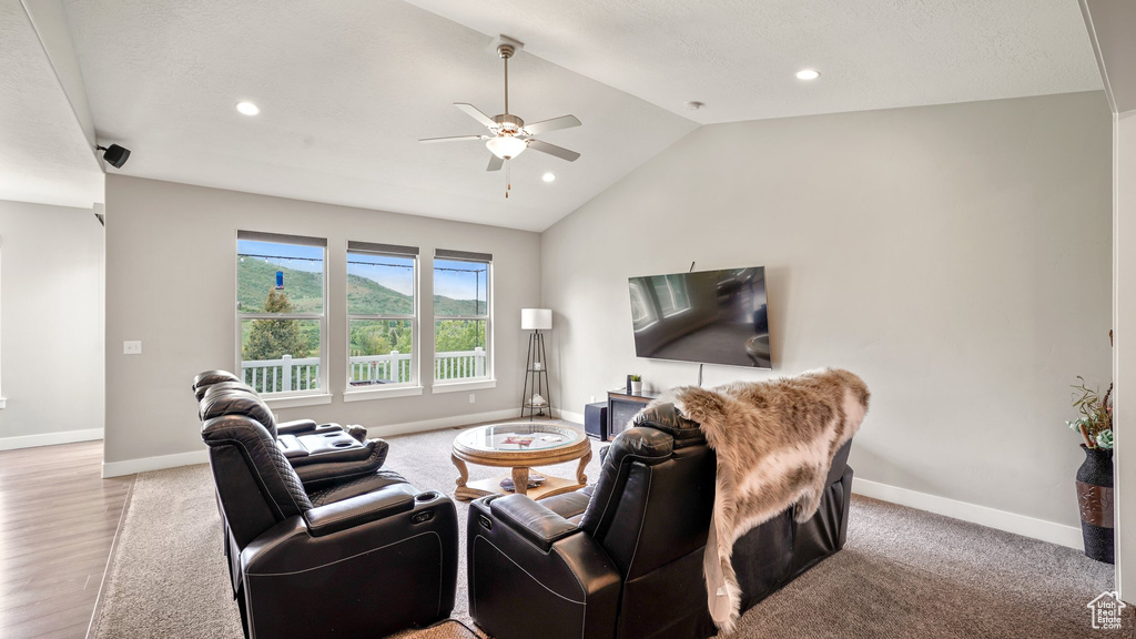 Living area with a ceiling fan, lofted ceiling, baseboards, recessed lighting, and light wood-style flooring