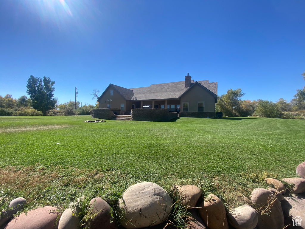 Exterior space featuring a front lawn