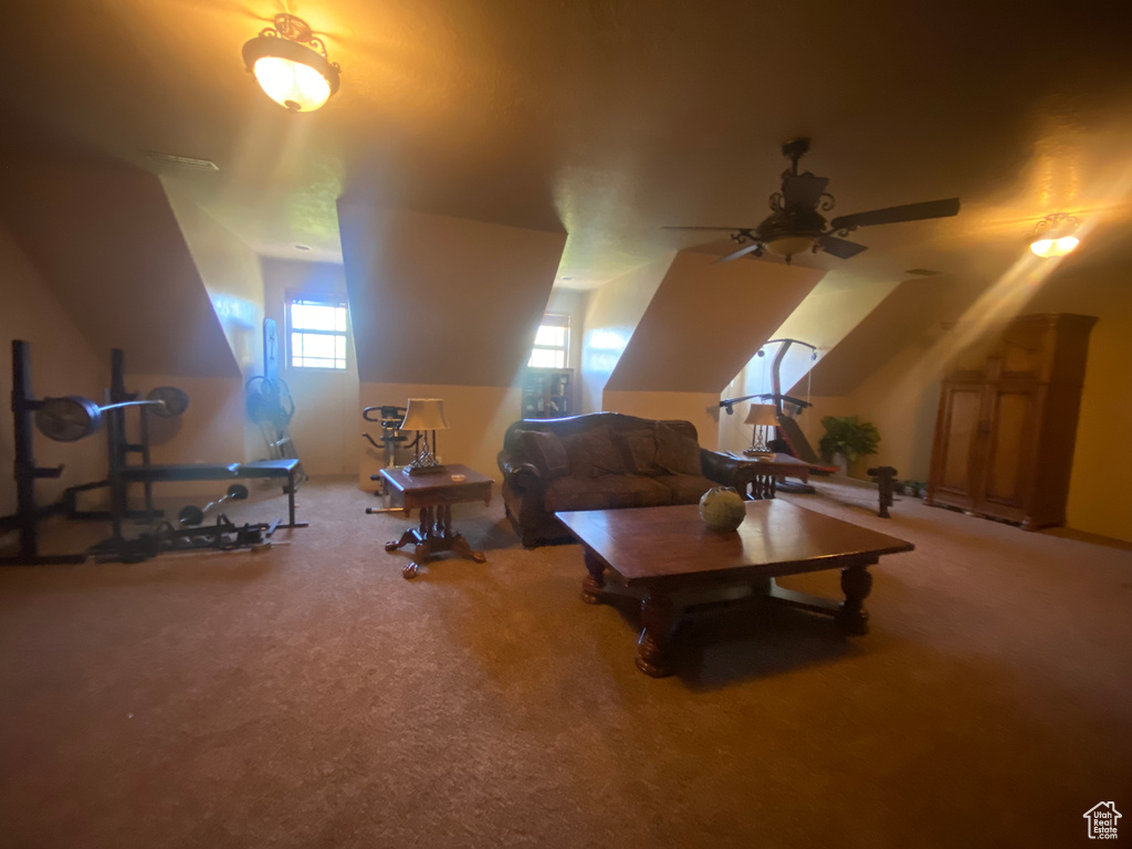 Interior space with ceiling fan and carpet