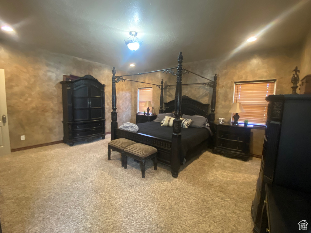 Carpeted bedroom with vaulted ceiling