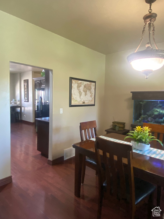 Dining space featuring dark hardwood / wood-style floors