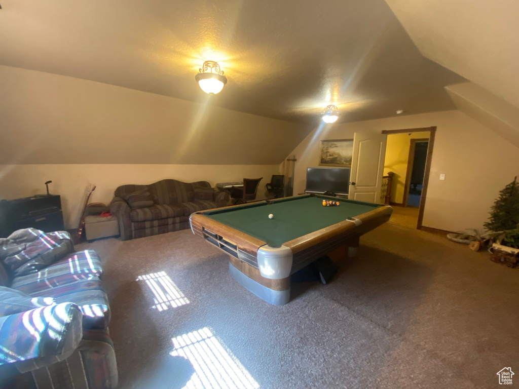 Rec room with pool table, vaulted ceiling, and carpet flooring