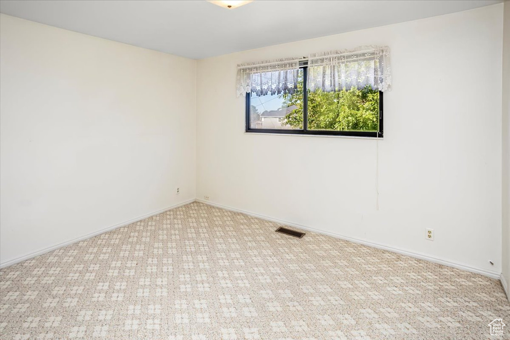 View of carpeted spare room