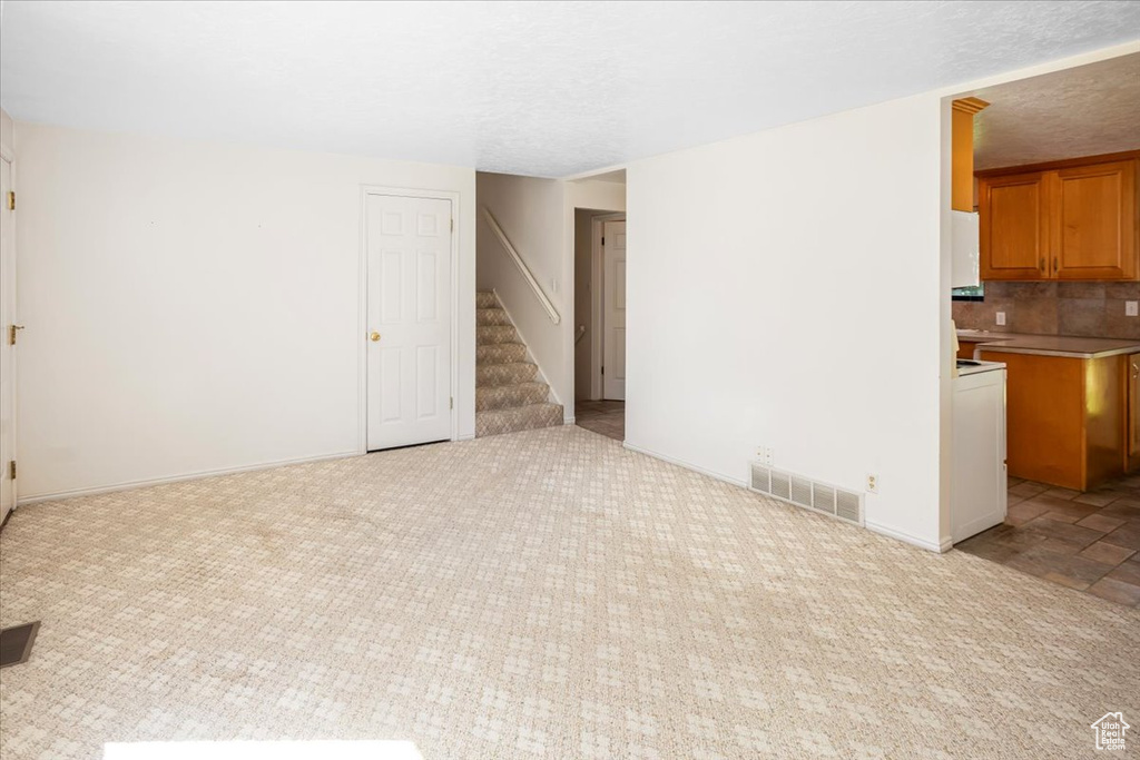 Interior space featuring a textured ceiling