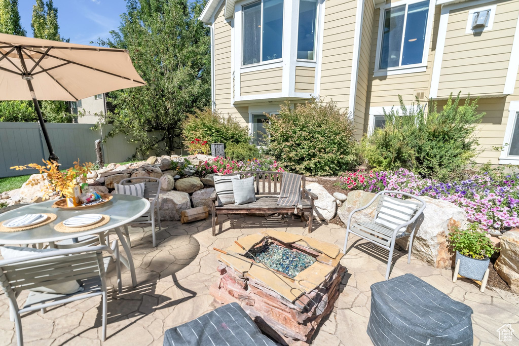 View of patio / terrace with a fire pit