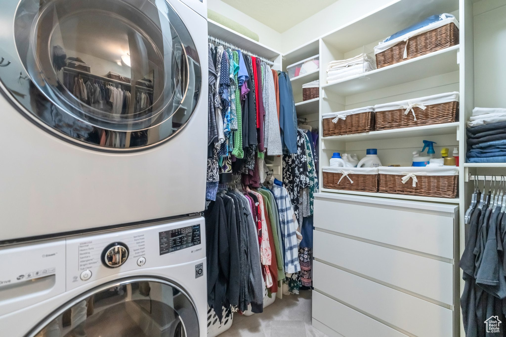 Clothes washing area with stacked washing maching and dryer