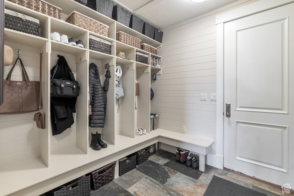 Mudroom with wood walls