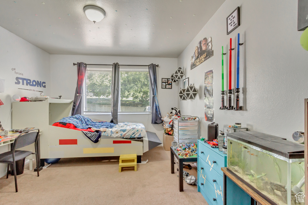 Bedroom with light colored carpet