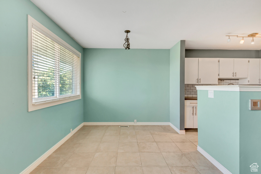 Interior space featuring light tile patterned floors