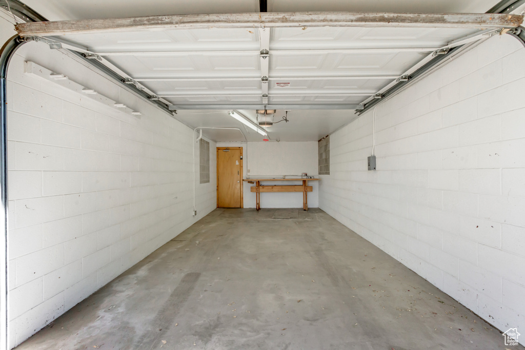 Garage featuring a garage door opener