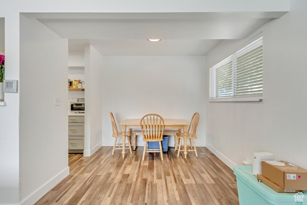 Dining space featuring light hardwood / wood-style flooring