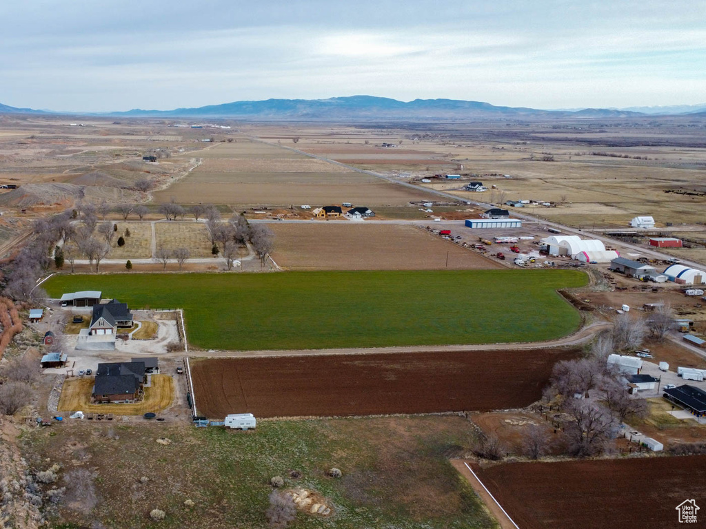 Birds eye view of property with a mountain view and a rural view