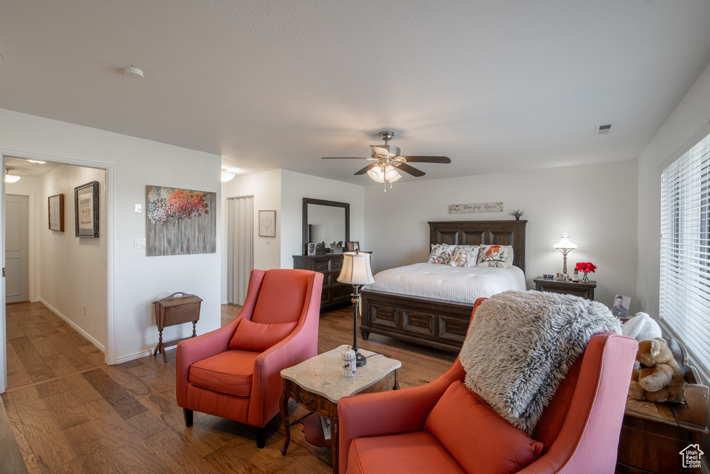 Bedroom featuring hardwood / wood-style floors and ceiling fan