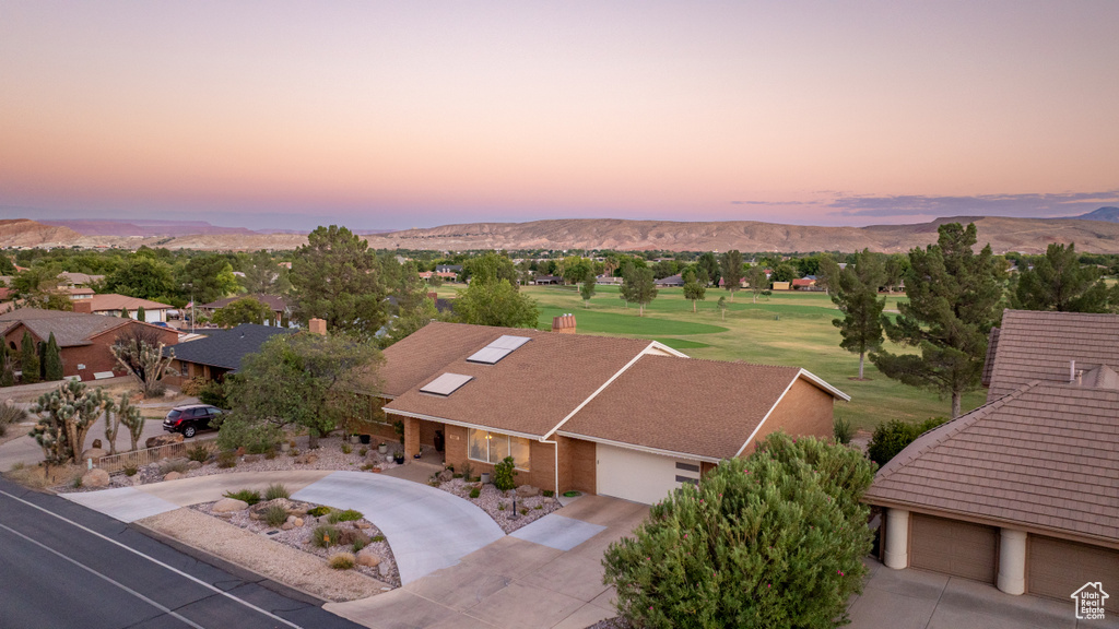 Aerial view at dusk featuring a mountain view