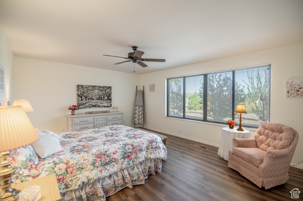 Bedroom featuring ceiling fan and dark hardwood / wood-style floors