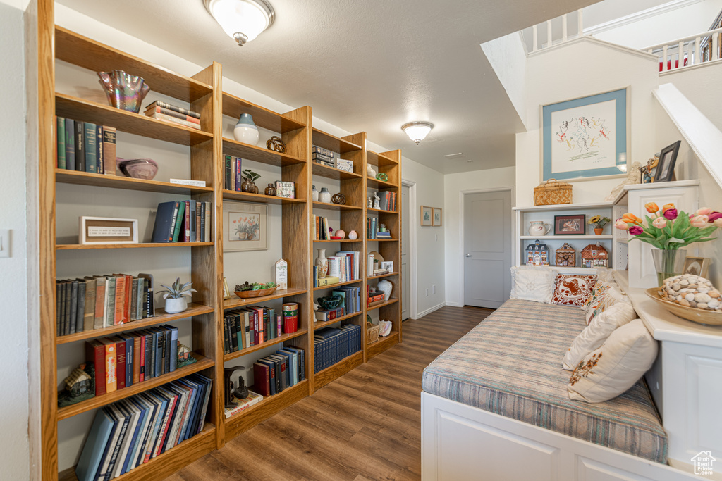 Living area featuring dark wood-type flooring